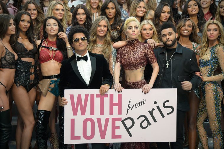 PARIS, FRANCE - NOVEMBER 30: Bruno Mars, Lady and The Weeknd pose with Victoria's Secret models backstage during 2016 Victoria's Secret Fashion Show on November 30, 2016 in Paris, France. (Photo by Dominique Charriau/Getty Images for Victoria's Secret)